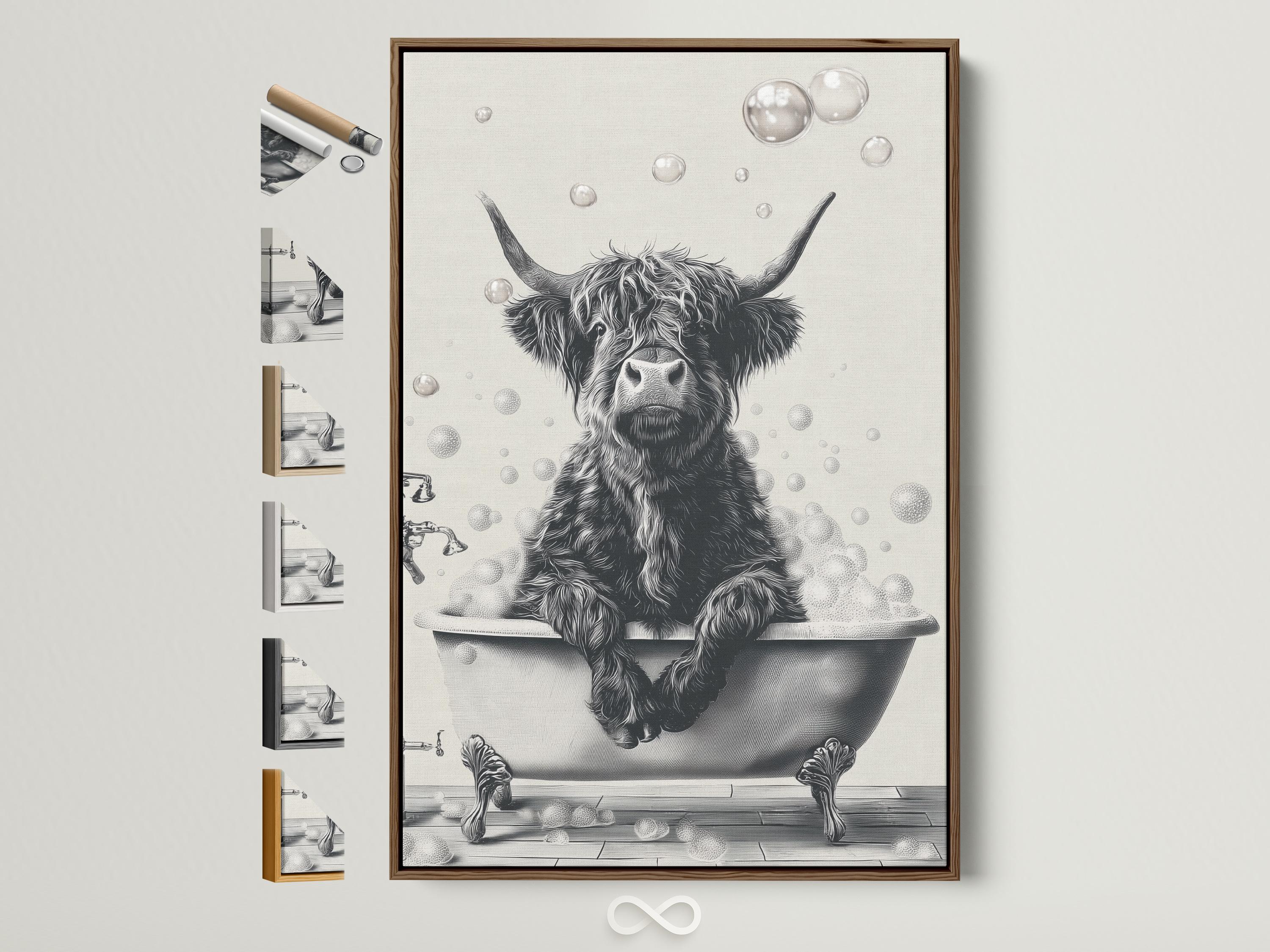 Woman holding a mug standing beside a framed monochrome highland cow bathtub artwork