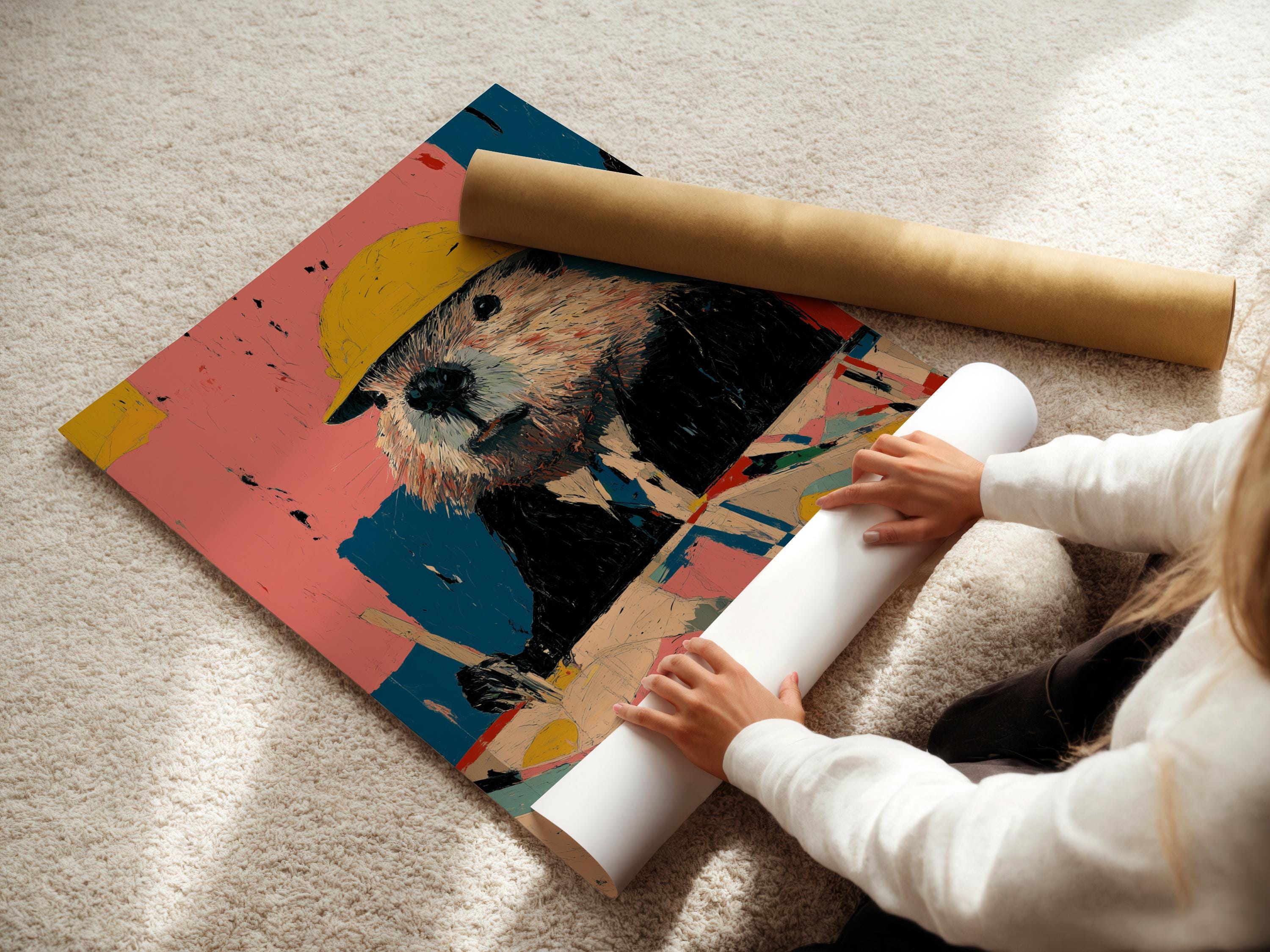 A person near a table installing a framed artwork featuring a beaver with a yellow hard hat