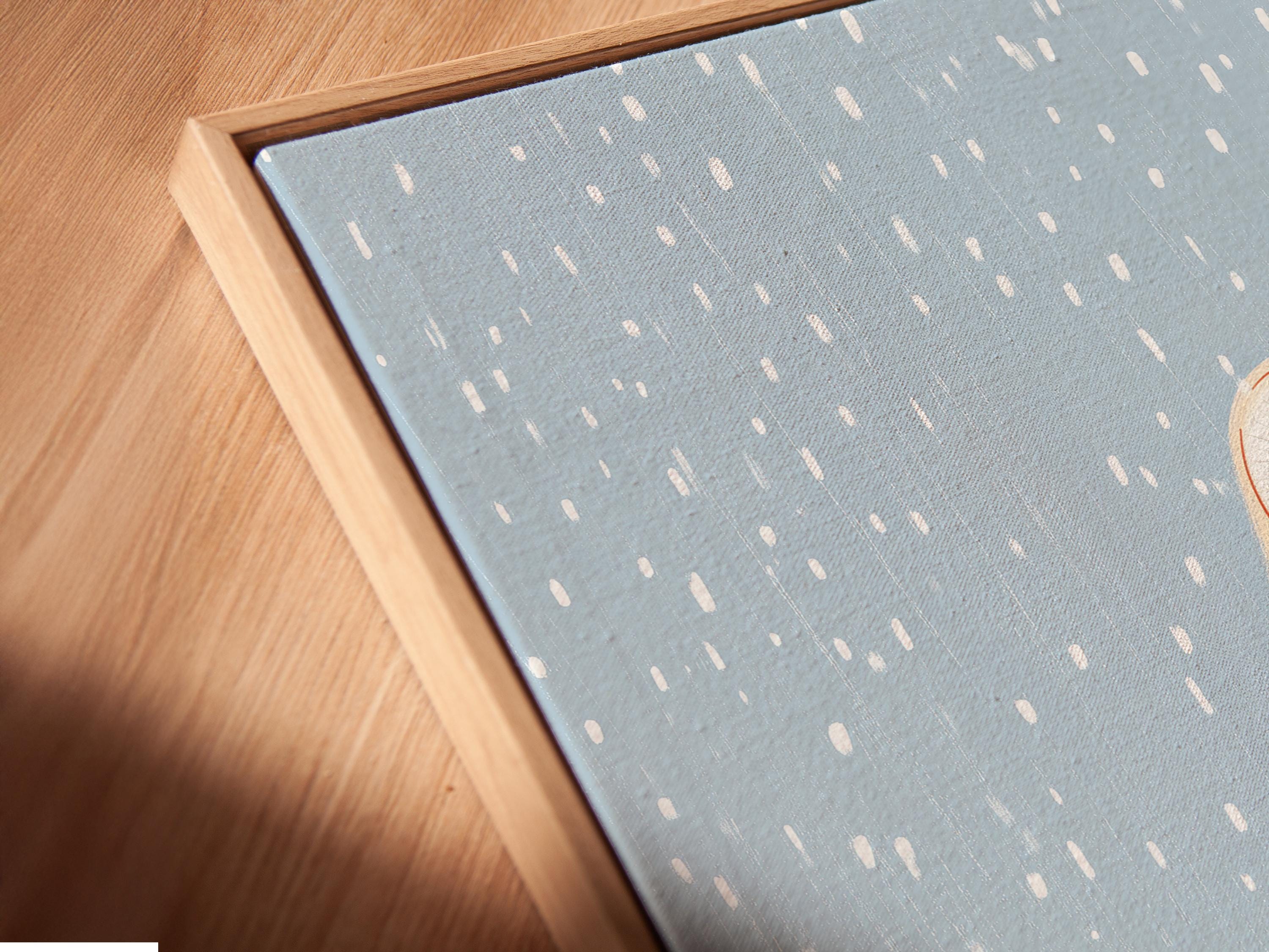 Illustrated owl flying through falling snow in a blue winter scene detail view
