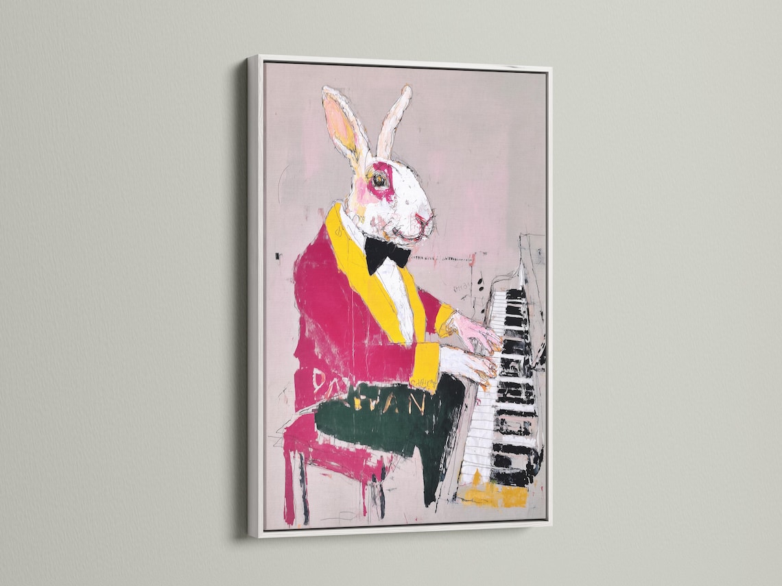 Rabbit playing piano with magenta and yellow jacket on a blush pink background detail view