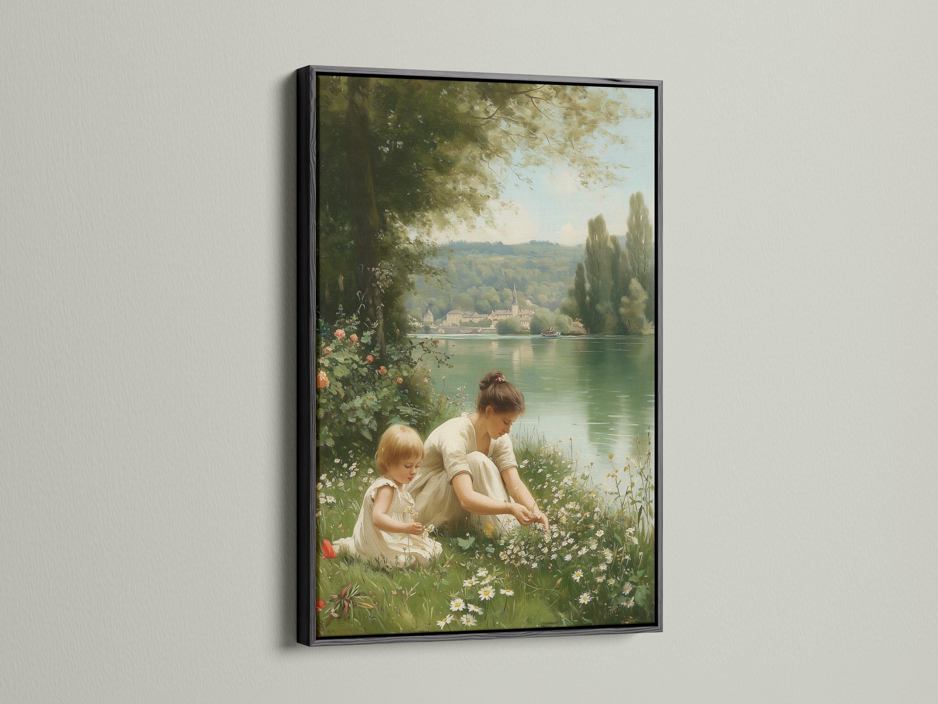 Mother and child sitting in a meadow by a calm lake with trees and distant buildings detail view