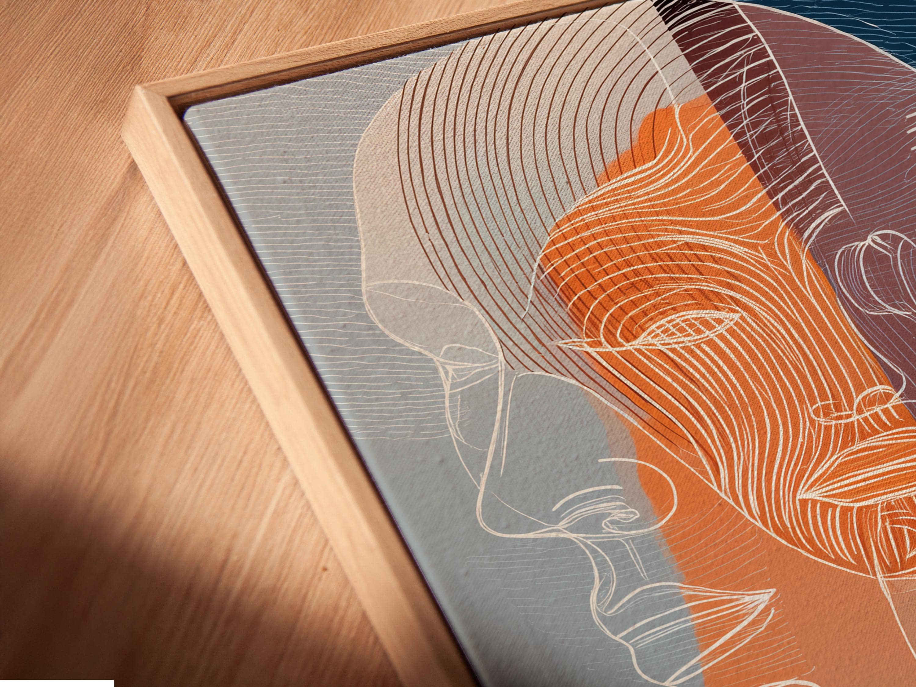 A pair of abstract line-illustrated faces fills the centre, layered in indigo, teal and warm terracotta/orange with flowing contour lines detail view