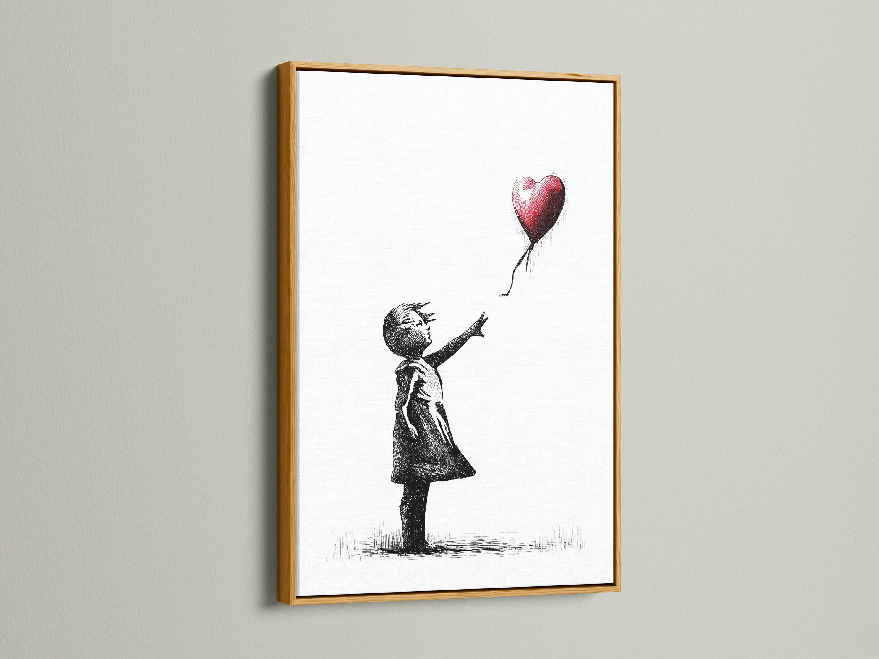 Room mockup showing a framed black and white girl sketch with a red heart balloon