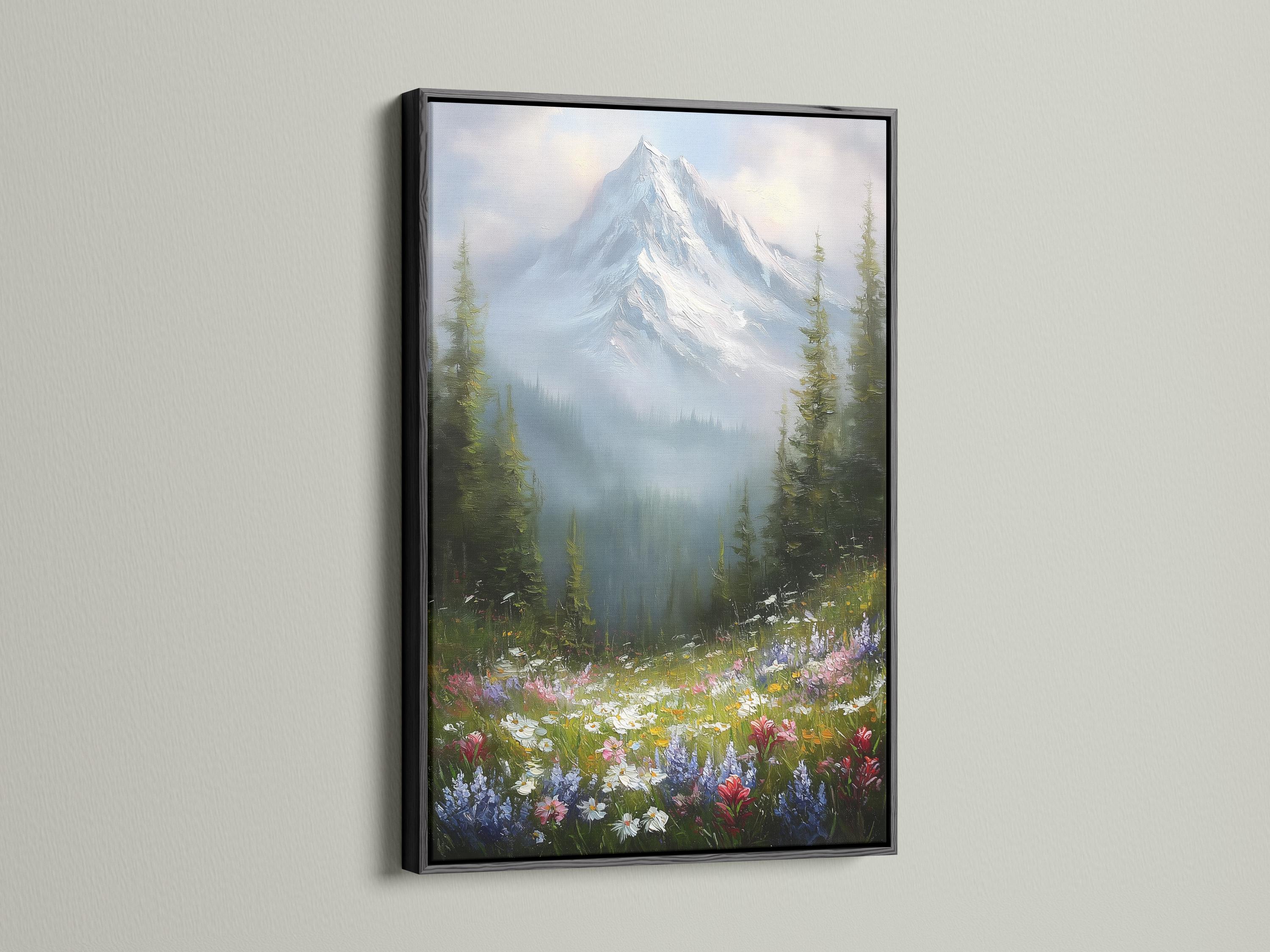 Wall mockup featuring a framed snowy mountain landscape with wildflowers and forest trees
