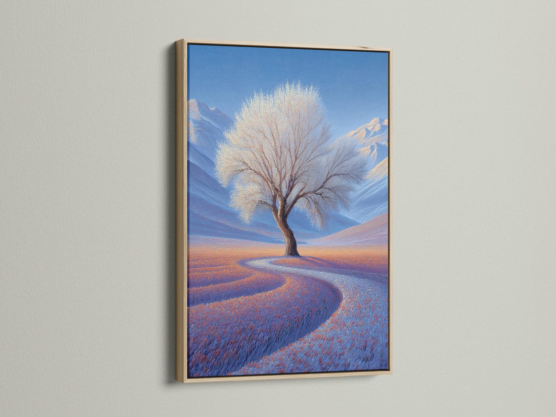 Lone leafless tree in a blue winter landscape with snowy hills and a warm orange horizon glow detail view