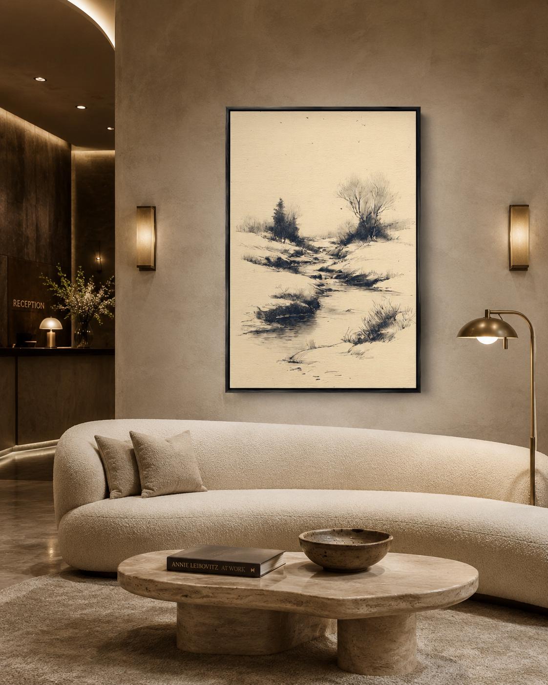 Woman holding a large framed beige river landscape sketch on a light wall in a bright room