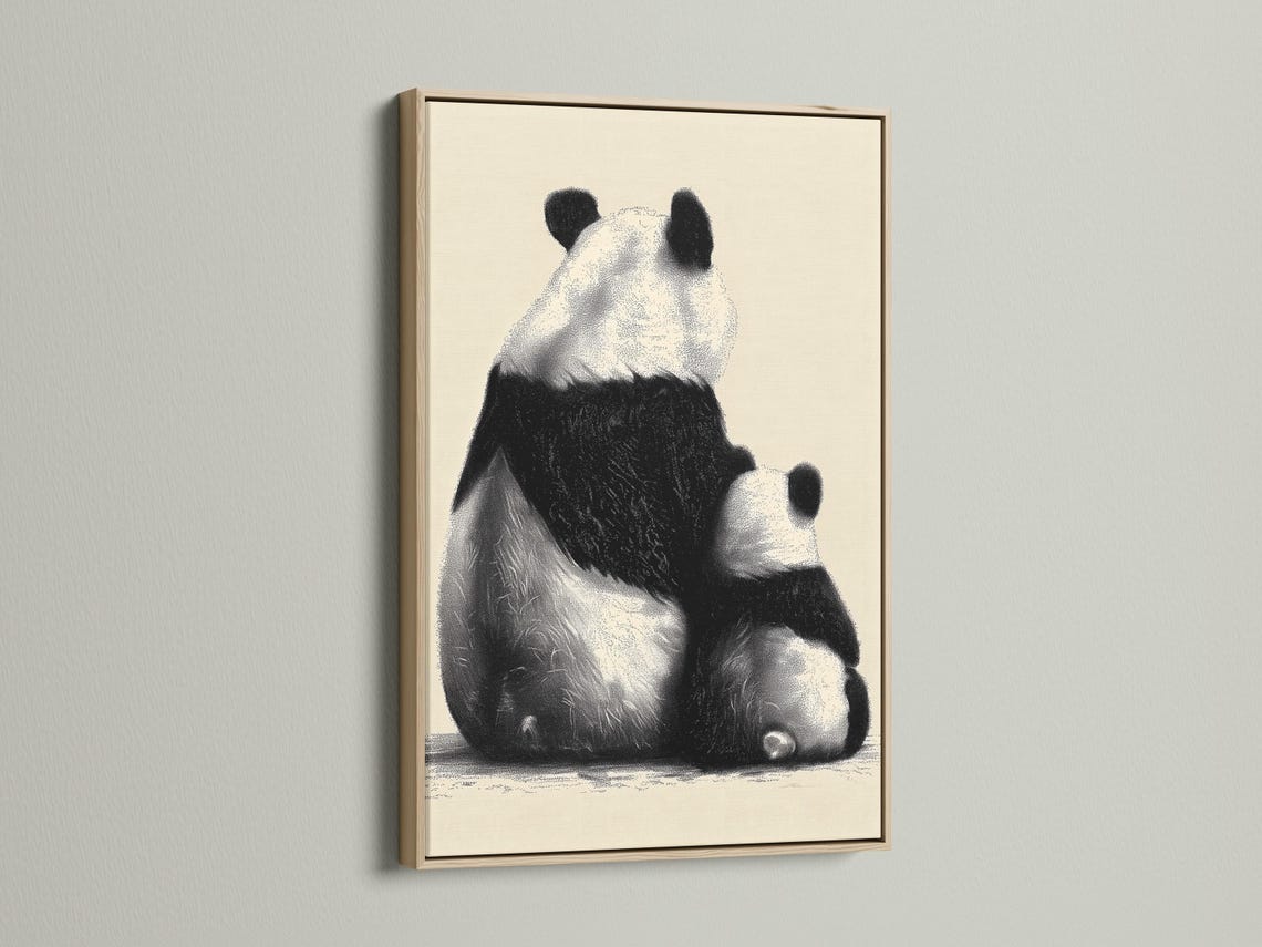 Wall mockup showing a framed panda portrait artwork in black and beige
