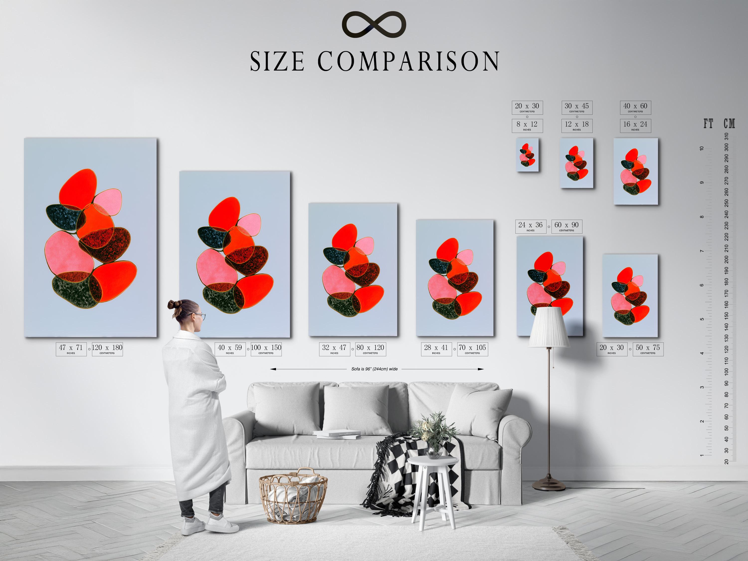 Room mockup showing a framed abstract artwork with overlapping red, pink and green shapes on a light blue background