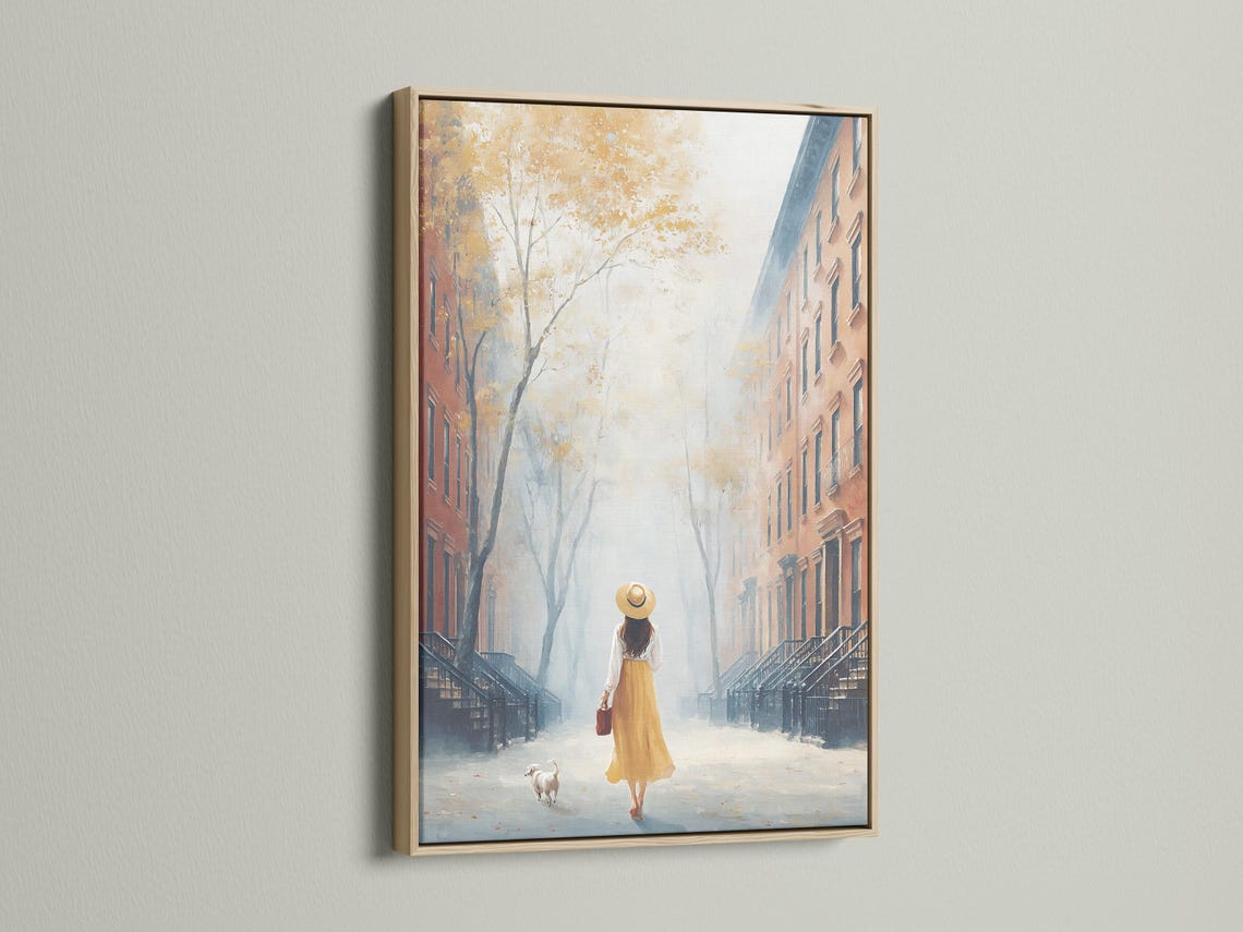 Room mockup showing a framed painterly city street scene with a woman walking a small dog