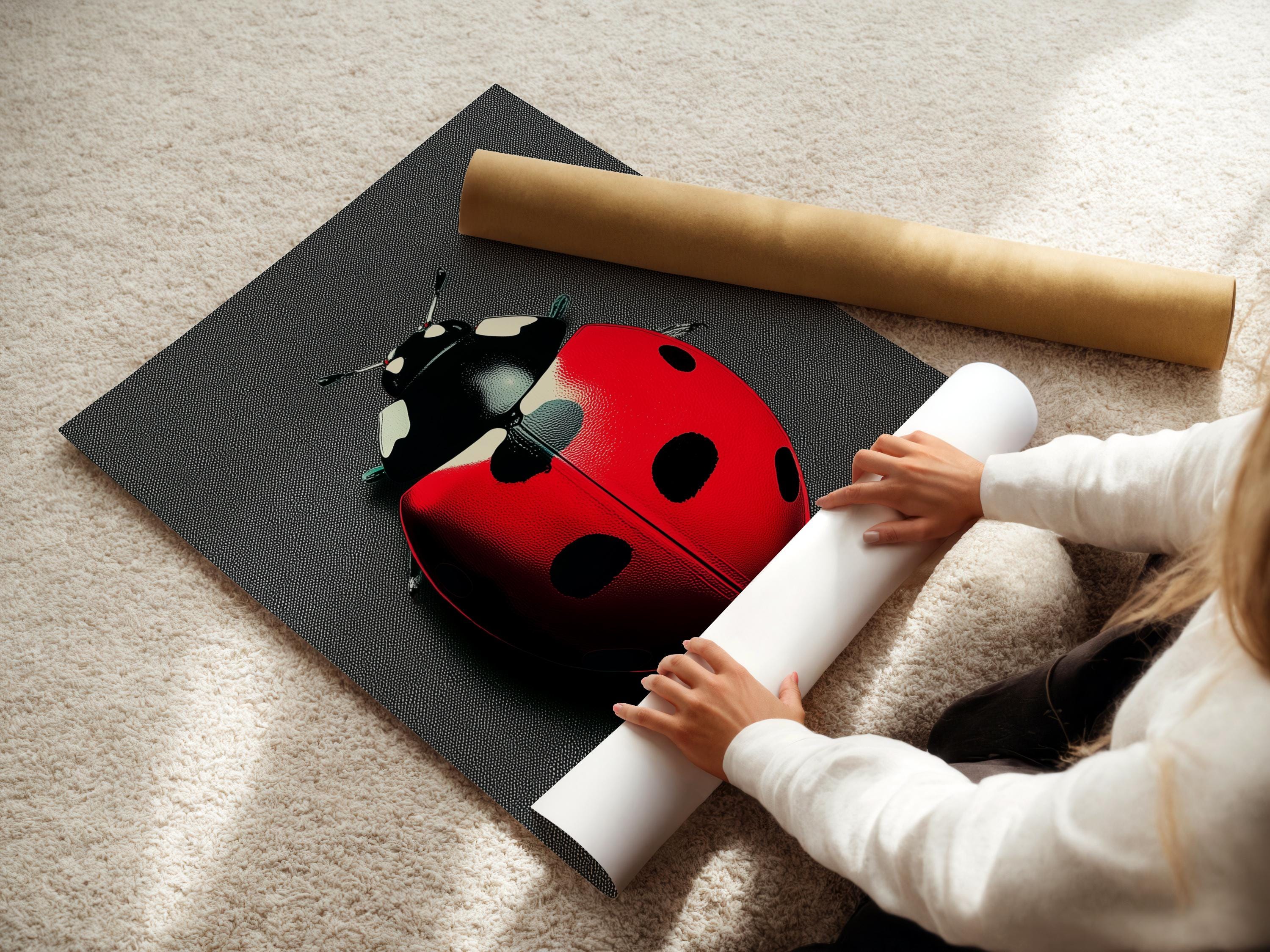 Ladybug beetle artwork displayed in a frame on a wall with hanging accessories to one side