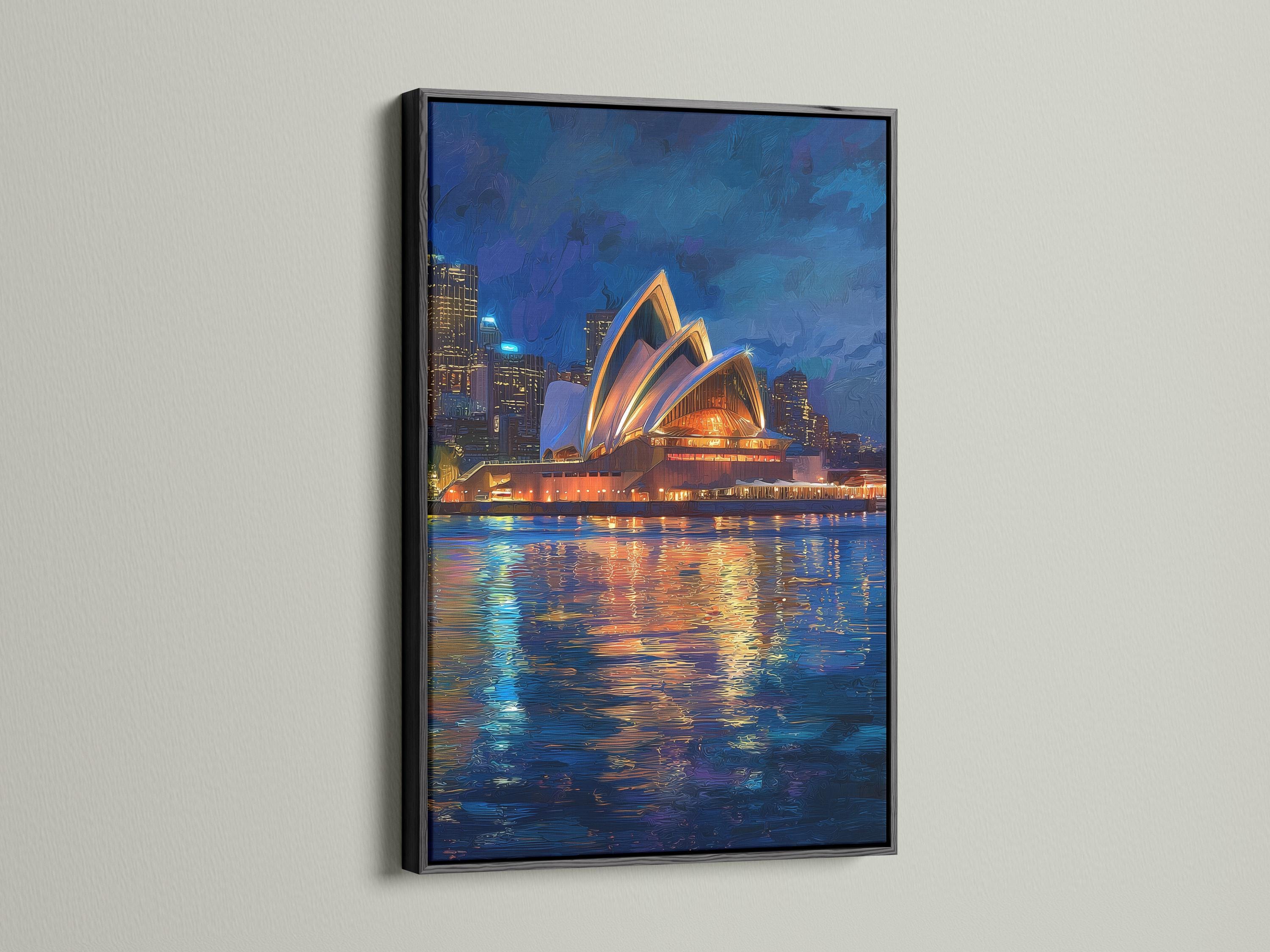 Framed night cityscape artwork featuring a glowing building and reflected lights on water