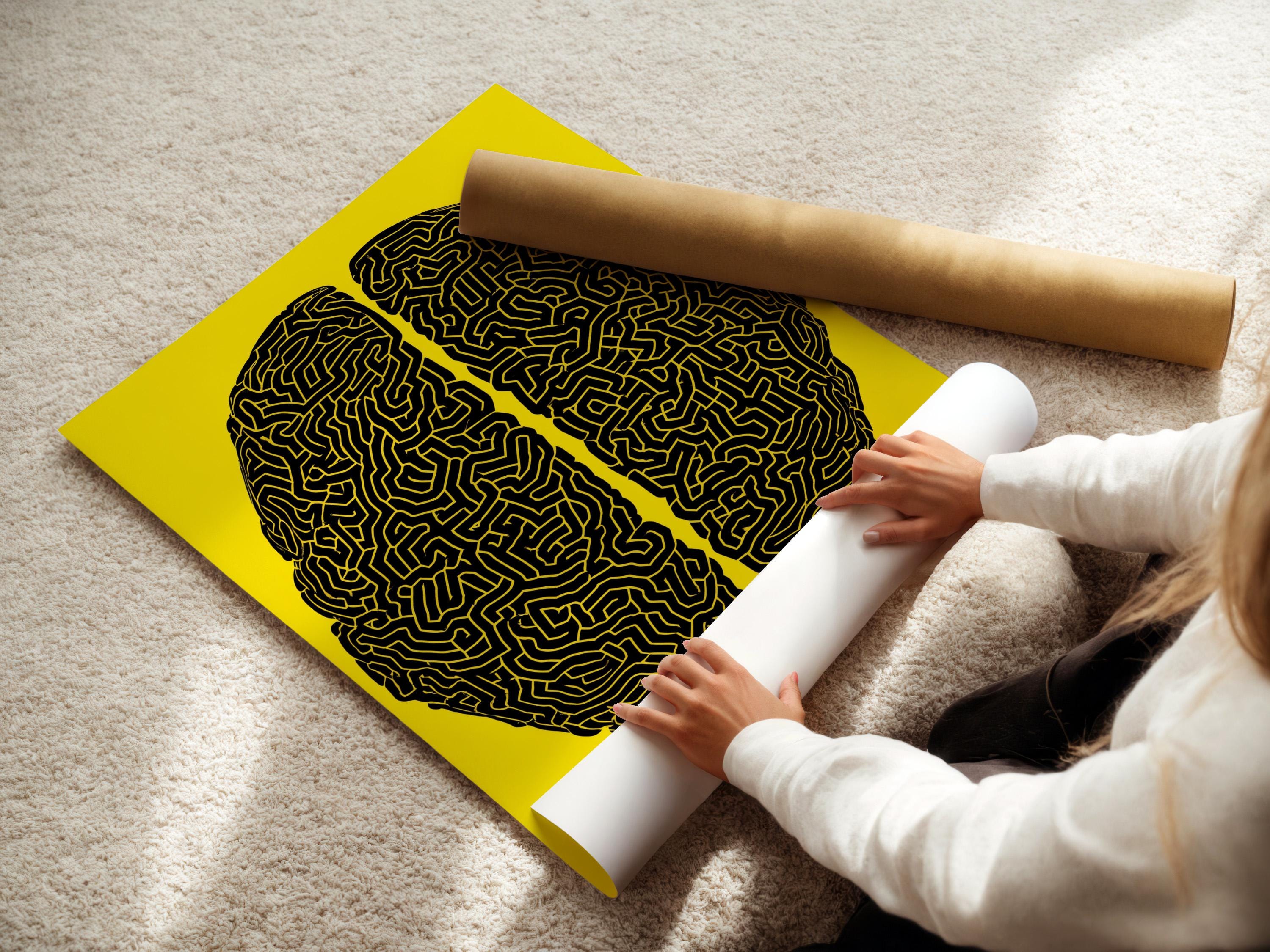 Two black brain silhouettes filled with maze-like lines on a yellow background detail view