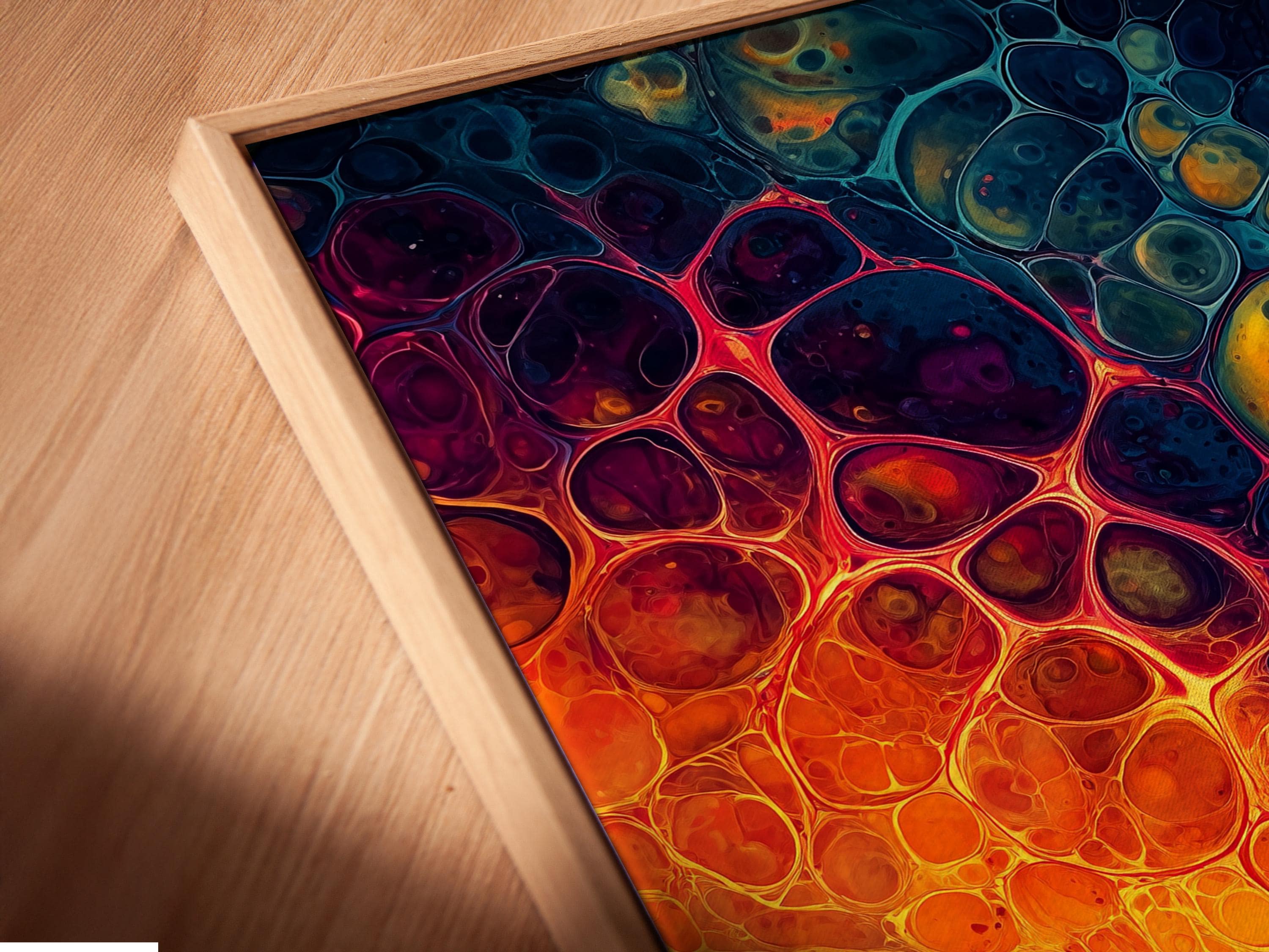 Abstract fluid artwork with orange and teal swirls and bubble-like circles detail view