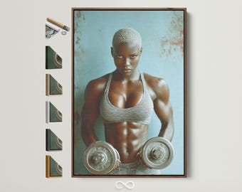 May include: A framed canvas print showing a muscular person holding two dumbbells. The person wears a grey sports bra and shorts. The background is a textured blue-grey. The dumbbells appear to be approximately 25 cm in diameter.