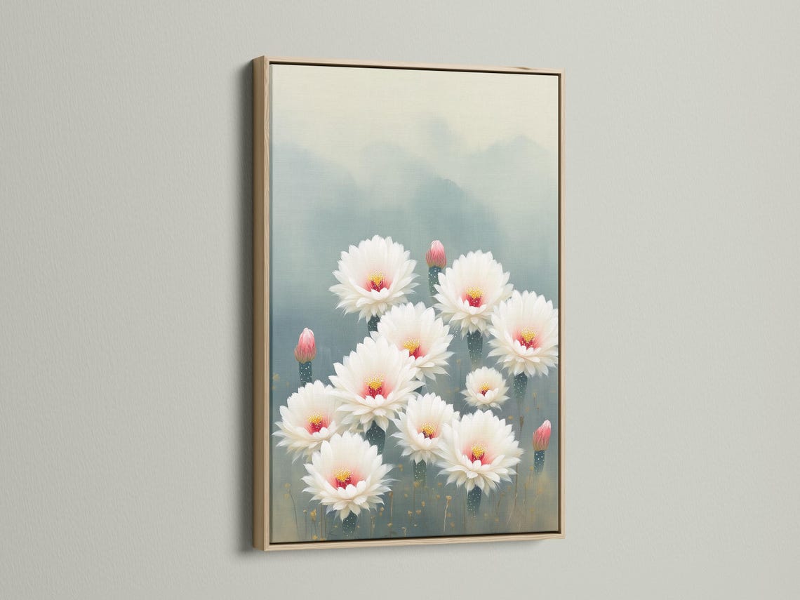 White cactus flowers with pink-red centres and gold specks on a blue-grey background detail view