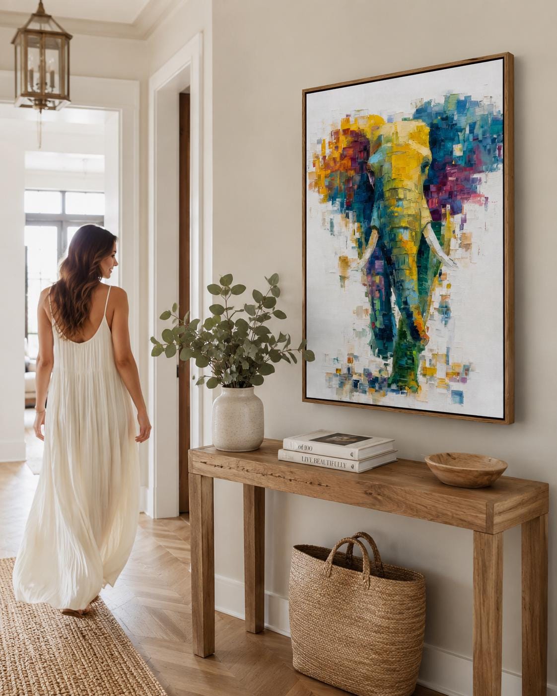Abstract elephant artwork with layered teal, yellow and magenta colour blocks on an off-white background detail view