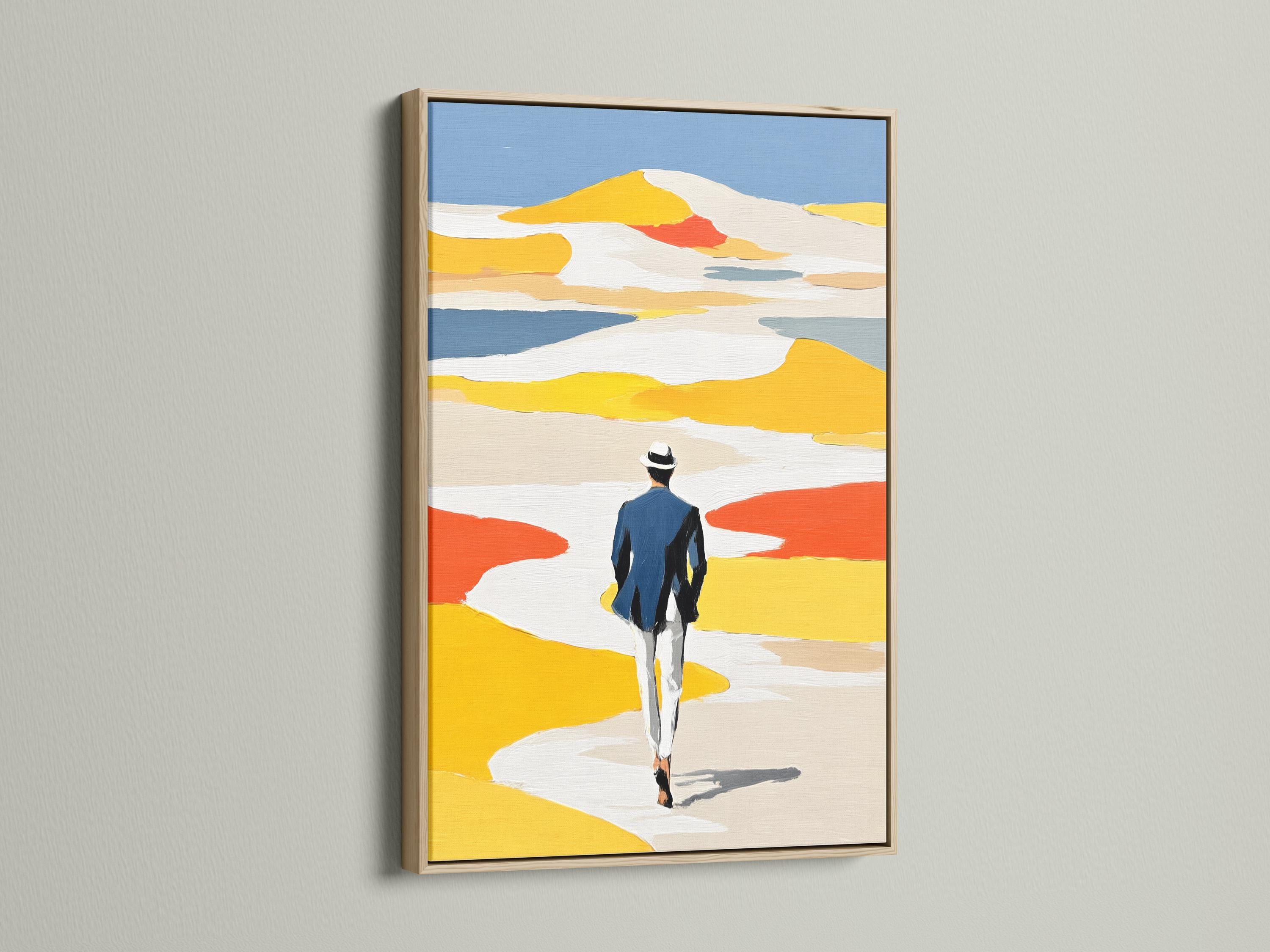Room mockup featuring framed coastal beach artwork with a person walking away in yellow dunes