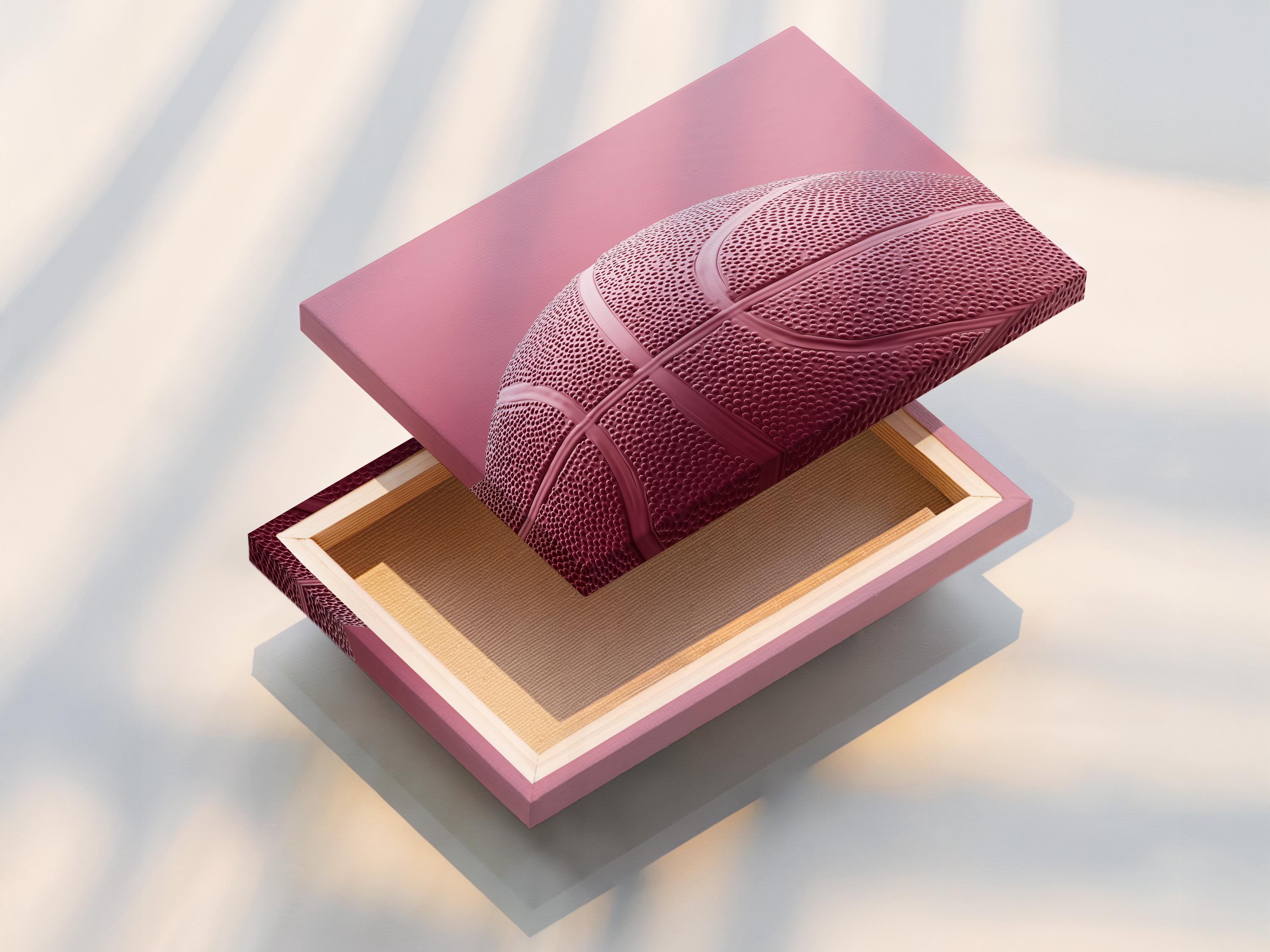 Woman sitting on a sofa beside a framed bubblegum pink basketball artwork