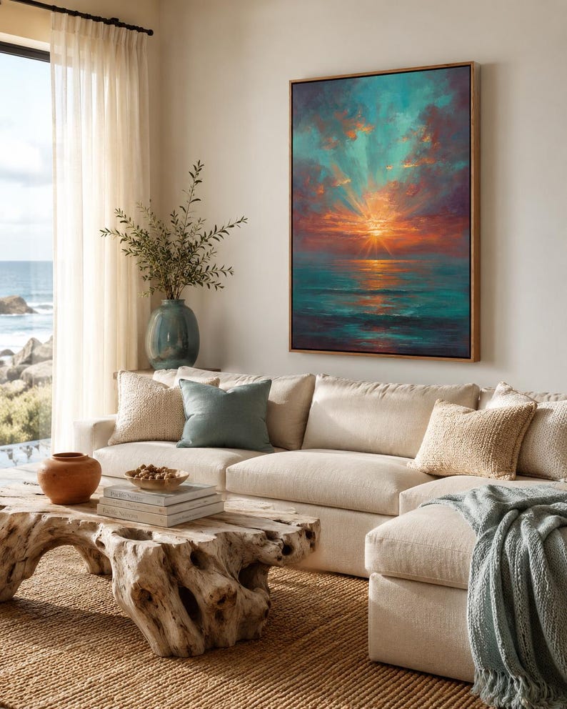 Teal and copper sunset seascape with an orange sun glowing on the ocean horizon and mirrored reflections