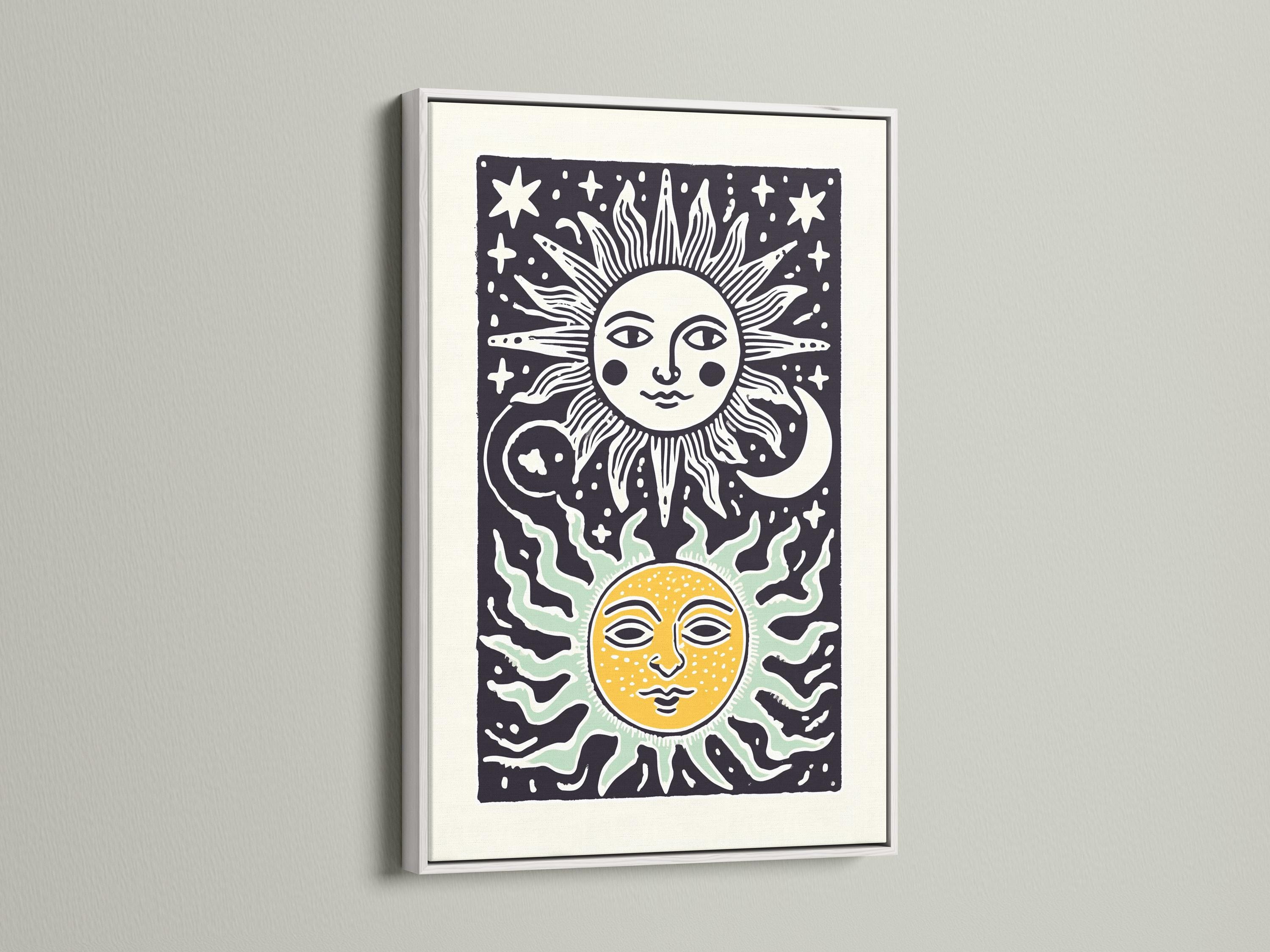 Room mockup showing framed sun and moon celestial artwork on a wall with decorative items nearby