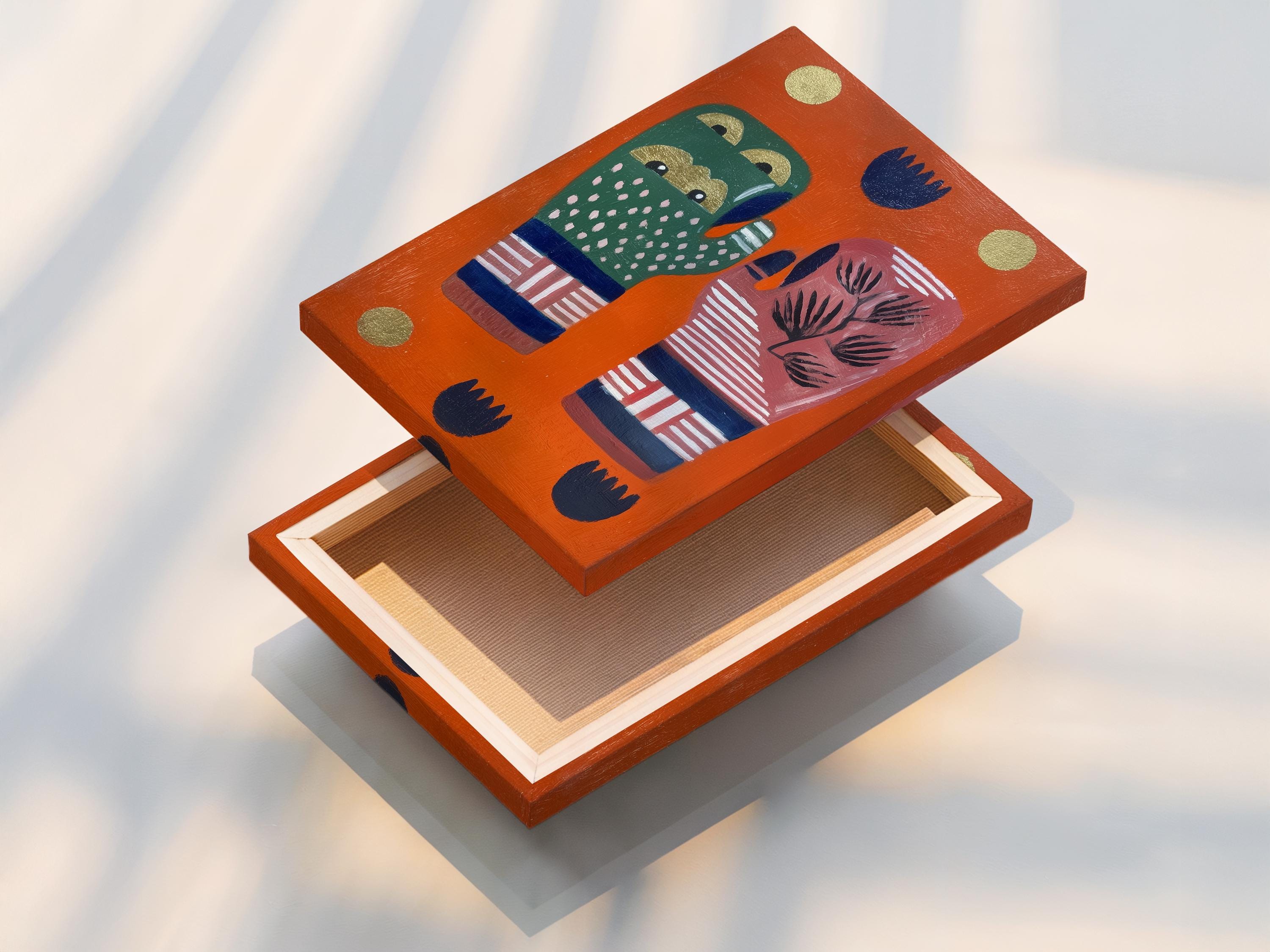 Room mockup showing orange folk art hands artwork with tree motif
