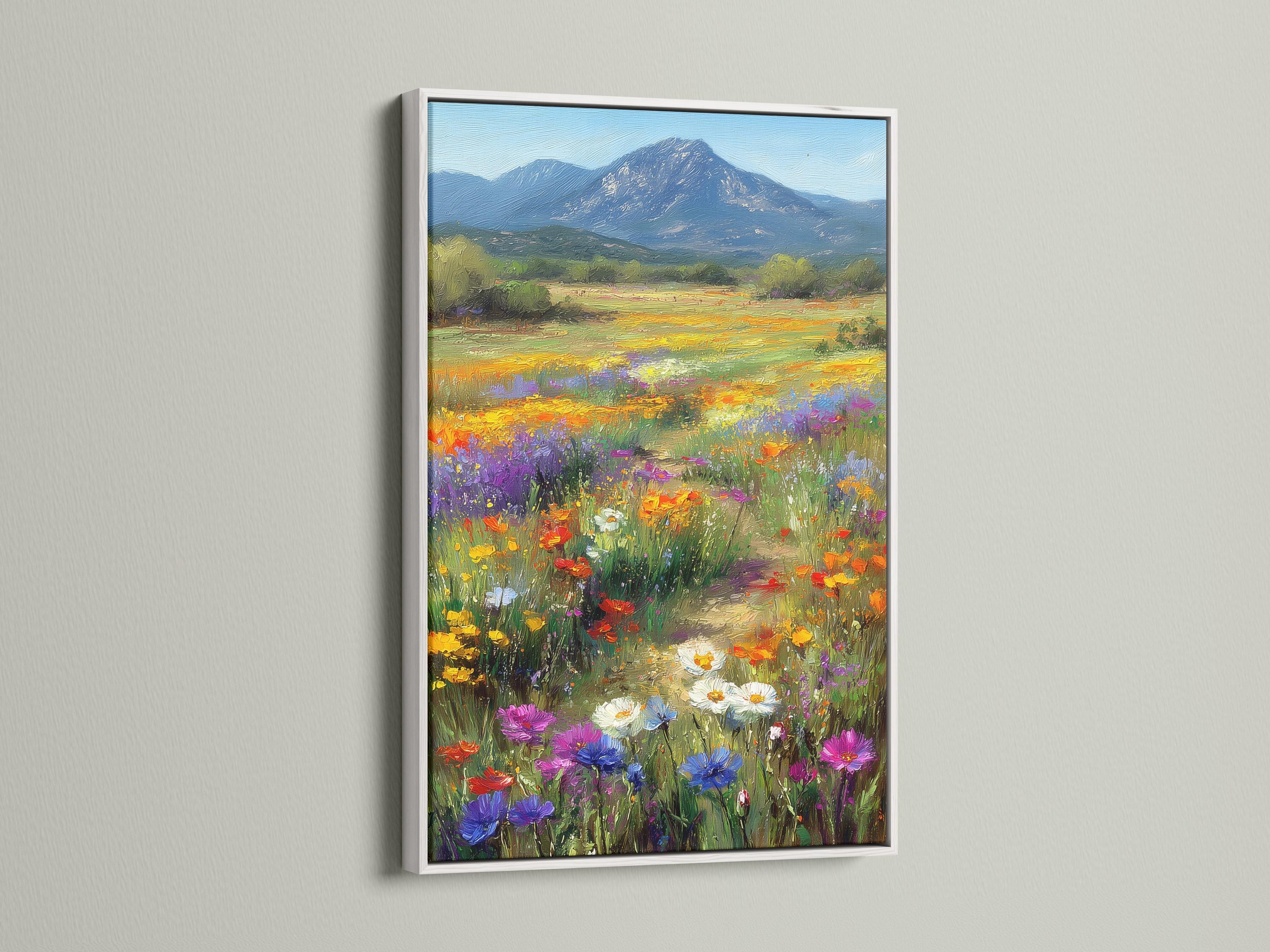 Wildflower meadow landscape with colourful flowers and a blue mountain detail view