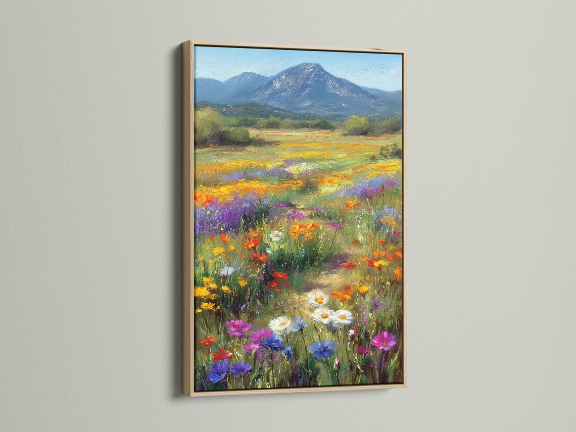 Wildflower meadow landscape with colourful flowers and a blue mountain detail view