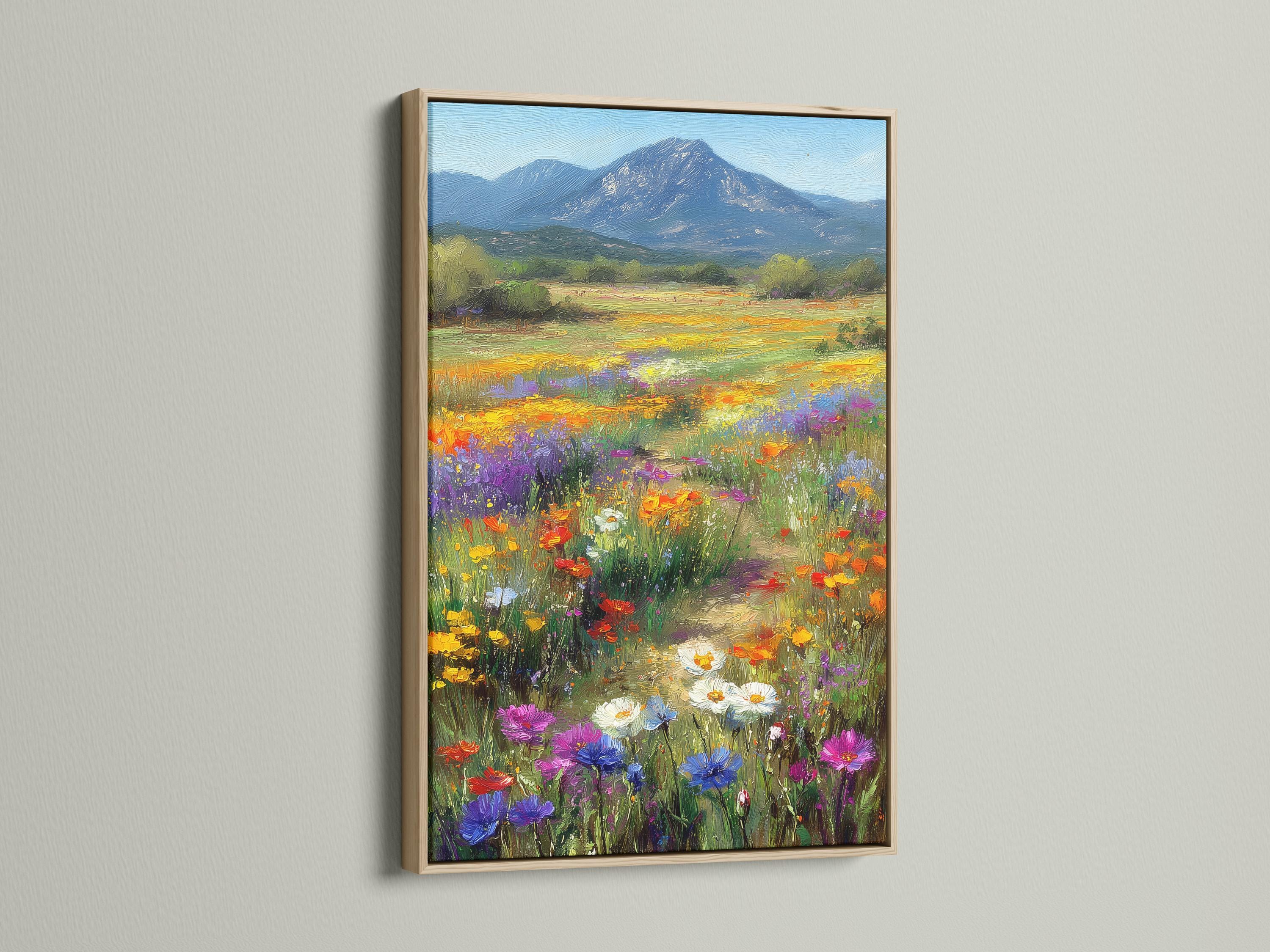 Wildflower meadow landscape with colourful flowers and a blue mountain detail view