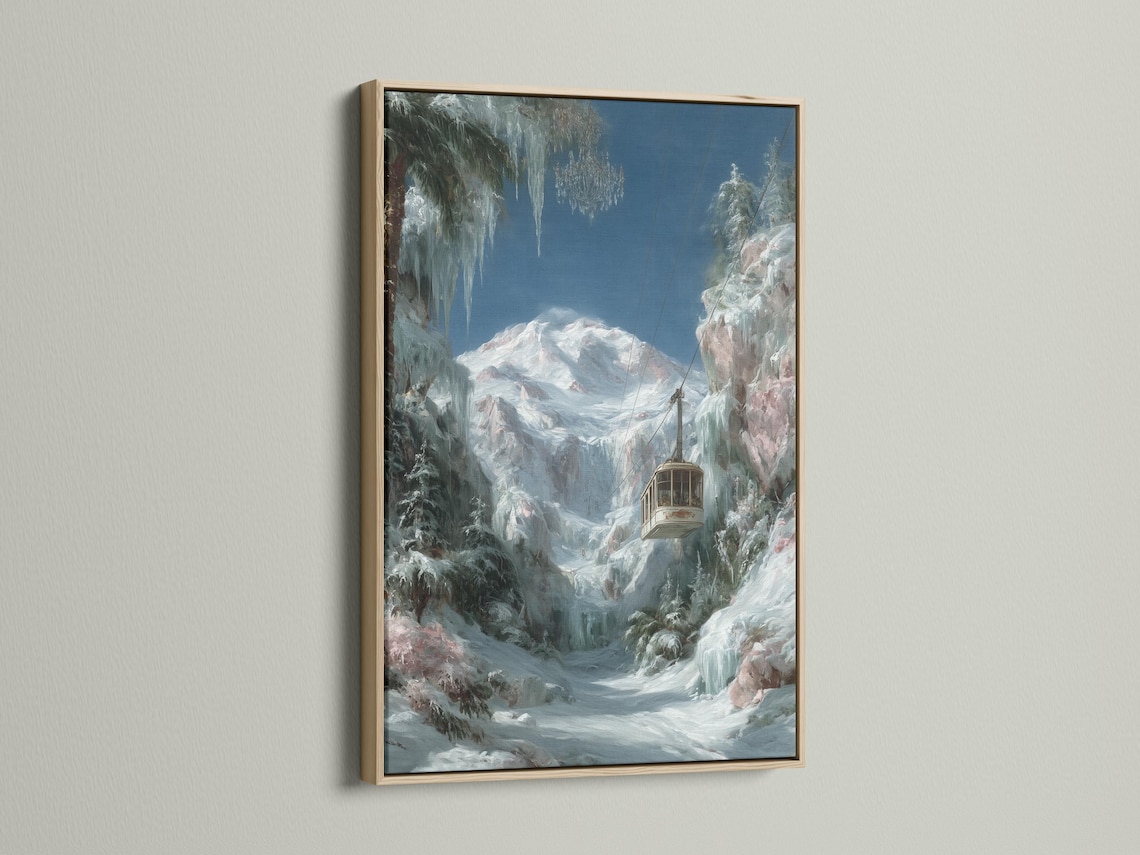 Wall mockup showing a framed snowy mountain cable car artwork on a light background