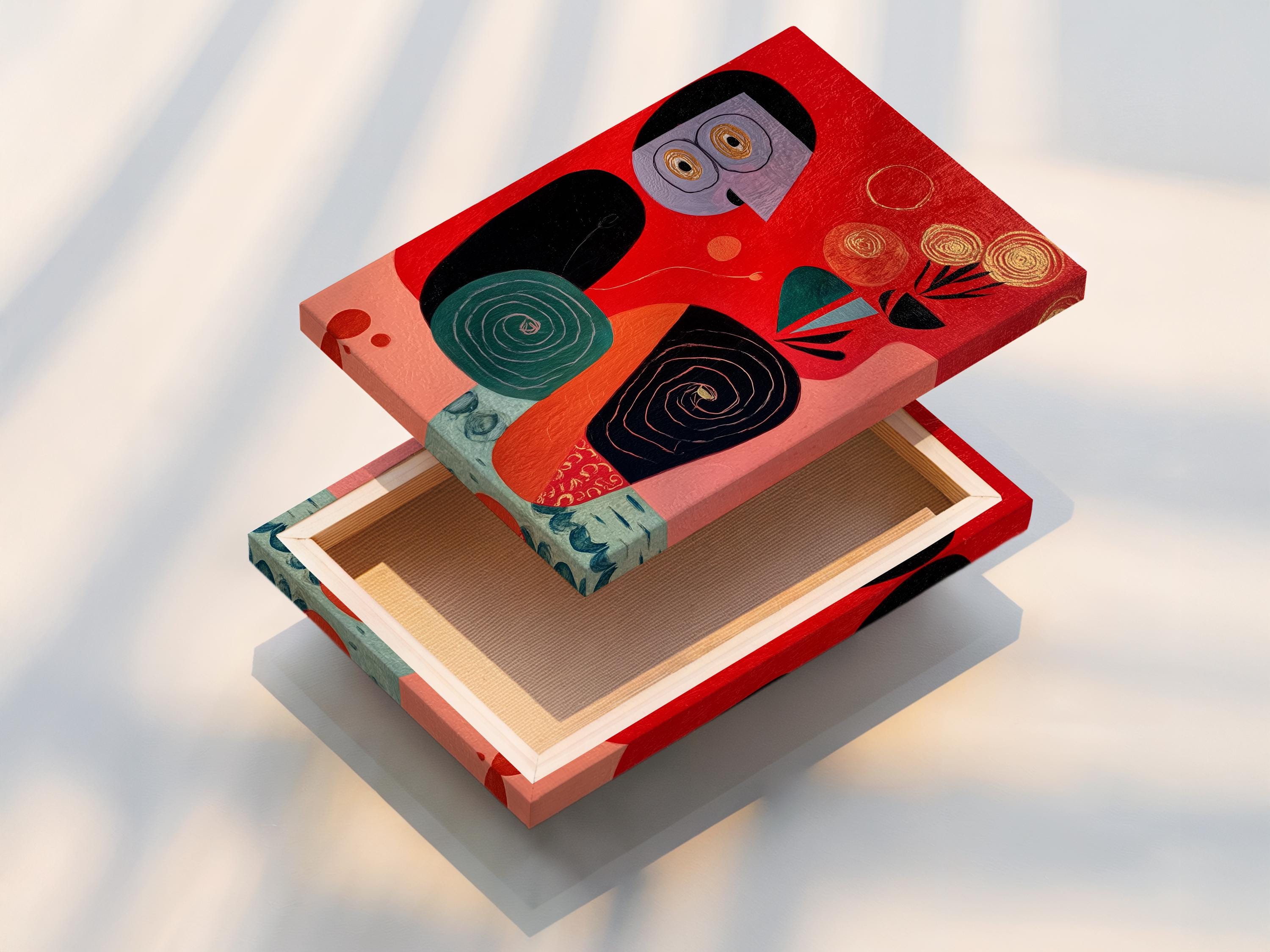Abstract face artwork with red background, teal accents, black outlines and spiral details detail view