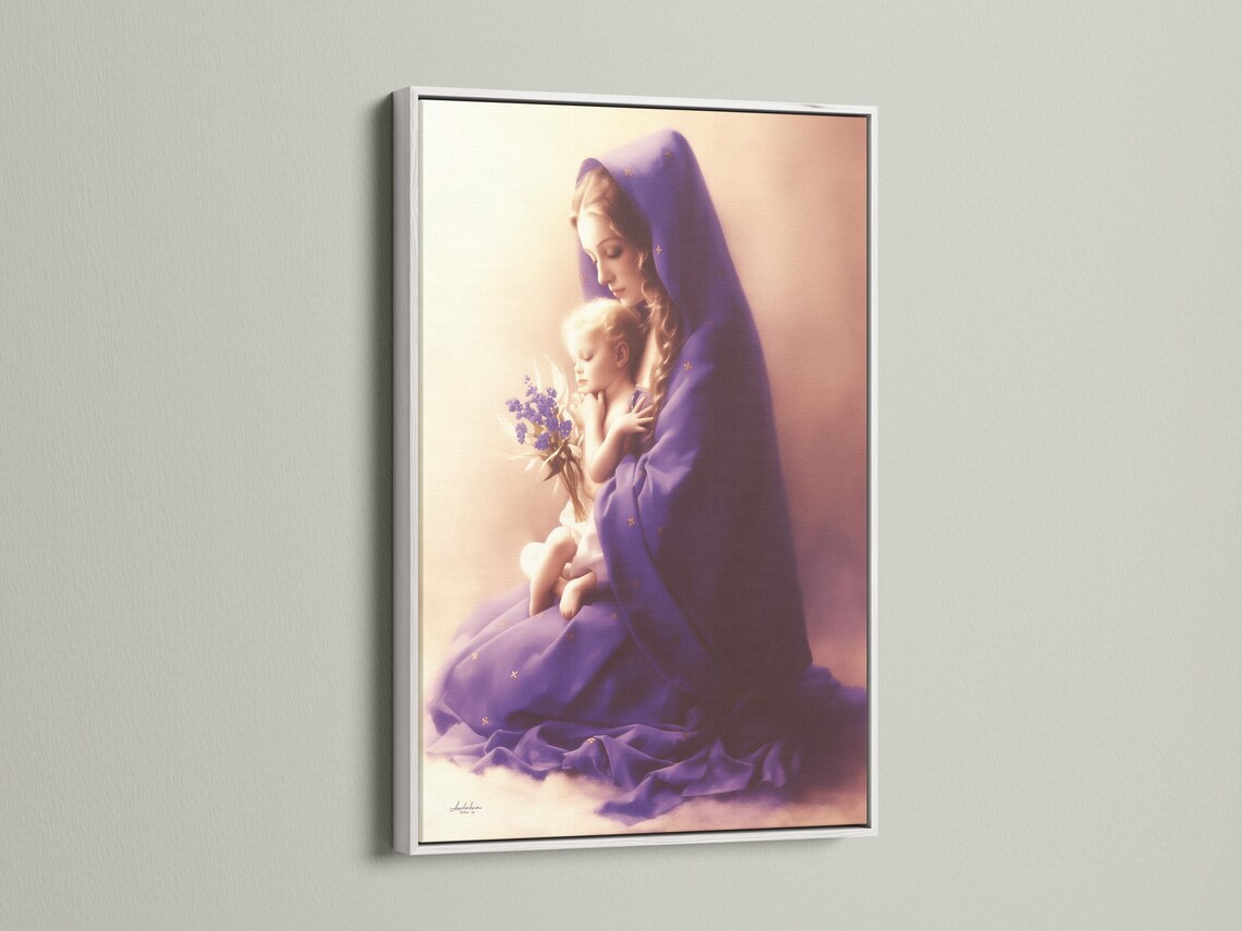 A softly lit Madonna figure in a purple veil holds a smiling baby, with a small bouquet of lilac flowers and delicate gold star-like marks detail view
