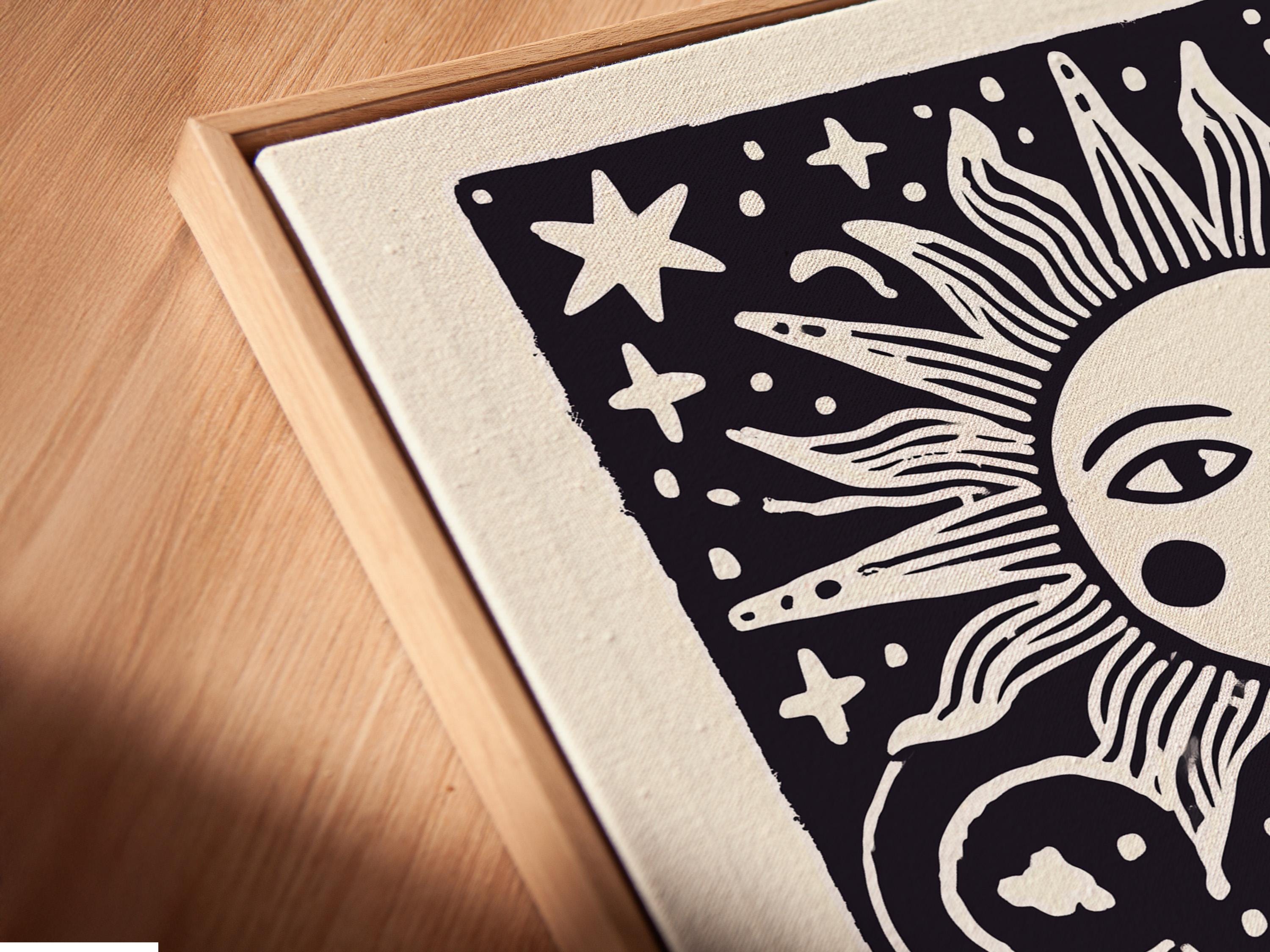 Room mockup showing framed sun and moon celestial artwork on a wall with decorative items nearby