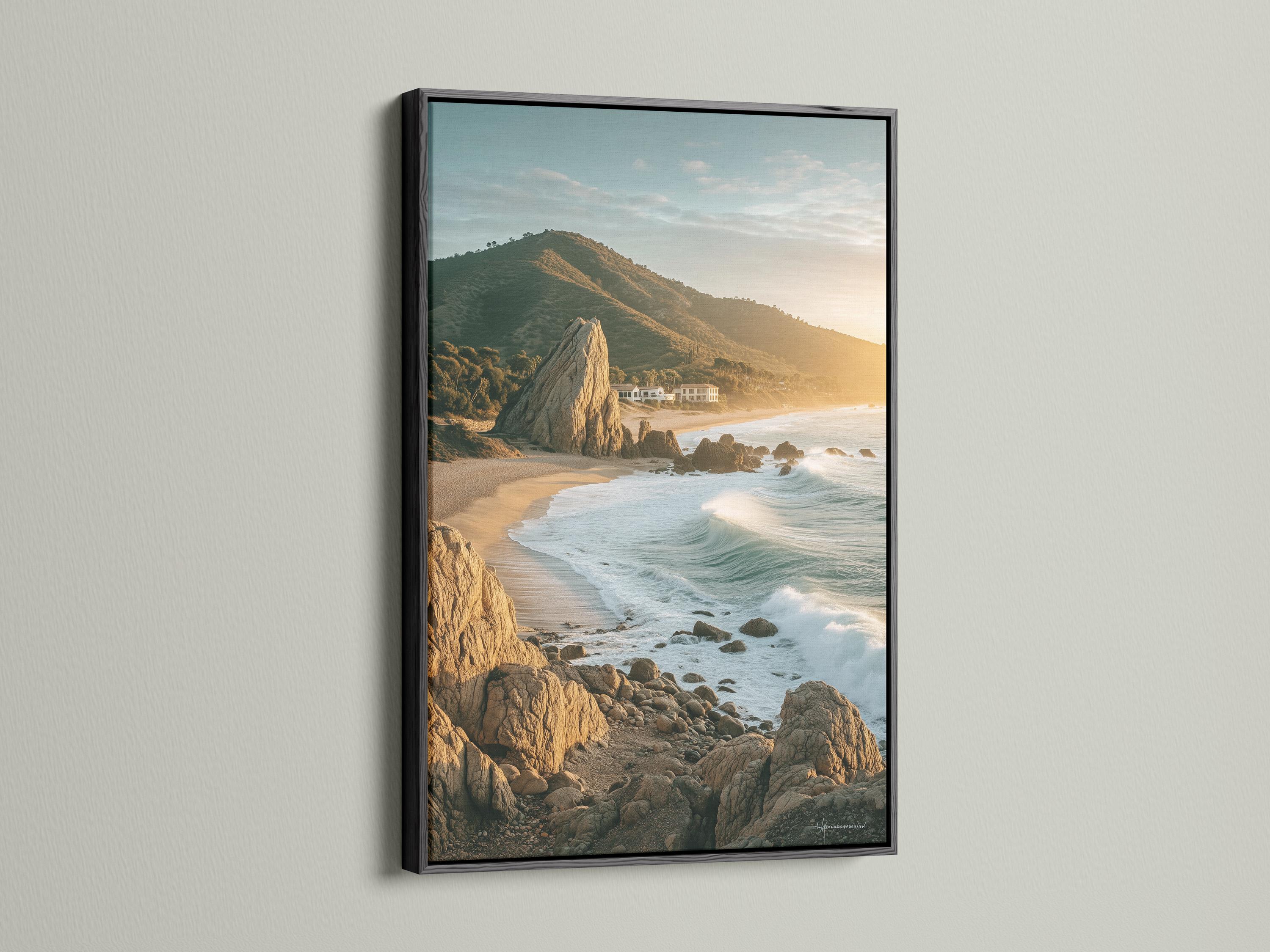 Golden hour seascape showing sandy shore, foamy waves, rocky cliffs and headland detail view