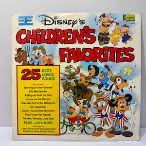 May include: A vintage Disney's Children's Favorites record album cover. The cover features colorful illustrations of Disney characters, including Mickey Mouse, Donald Duck, and Goofy. The album includes 25 best-loved songs.