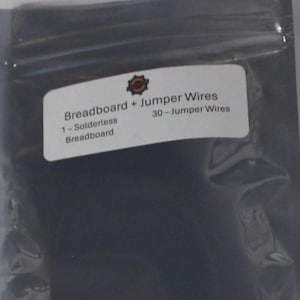 May include: A breadboard kit with jumper wires. The kit includes a solderless breadboard, 30 jumper wires, and a clear plastic bag. The jumper wires are multi-colored. The breadboard has multiple holes for electronic components.