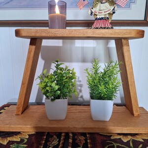 Shelf hang or stand.