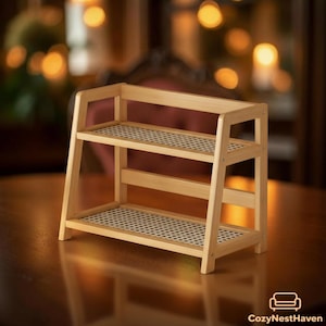 May include: A light-colored, two-tiered bamboo shelf with a rectangular frame. The shelves have a woven pattern. The shelf is designed with a sturdy, angled side frame. The CozyNestHaven logo is in the bottom right corner.
