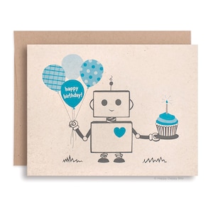May include: A birthday greeting card featuring a cartoon robot holding blue balloons that say "happy birthday!" and a cupcake with a lit candle. The card has a kraft paper envelope.