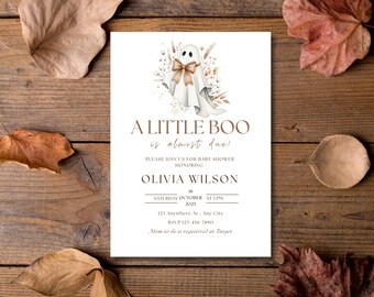 May include: A baby shower invitation with the text "A Little Boo is almost due!" features a watercolor ghost with a bow. The invitation includes details for Olivia Wilson's baby shower, set for Saturday, October 18th, at 3 PM.