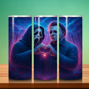 May include: Three stainless steel tumblers with a spooky design. The design features two figures forming a heart shape with their hands, set against a graveyard and lightning. The color palette is dark blue, purple, and pink. The tumblers are suitable for cold drinks.