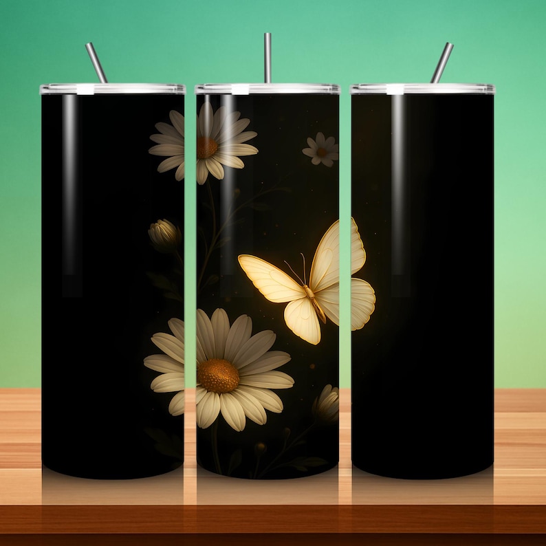 May include: A black tumbler with a white lid and straw. The tumbler features a design of white daisies and a butterfly with yellow wings. The background is black with a touch of yellow.