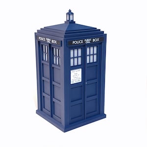 May include: A blue Police Box model with white window panes and a small lantern on top. The words "POLICE PUBLIC BOX" are displayed above the windows. A sign on the door reads "FREE FOR USE OF PUBLIC".