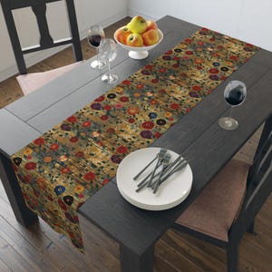 May include: A rectangular table runner featuring a dense, repeating pattern of small red, yellow, blue, and purple flowers with green stems on a textured, weathered wood-grain background in shades of brown, tan, and dark gray.