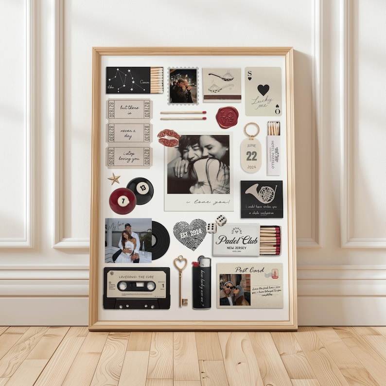 May include: A framed collage featuring various mementos, including photos, tickets, and a cassette tape. The items are arranged on a white background within a wooden frame. The collage includes a photo with the text "I love you!" and a heart-shaped design with the text "EST 2024".