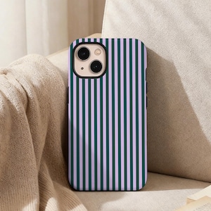May include: A smartphone case featuring a repeating vertical striped pattern in alternating shades of dark forest green and light lavender. The case has a rectangular cutout at the top left corner for the camera lenses and a black camera frame.