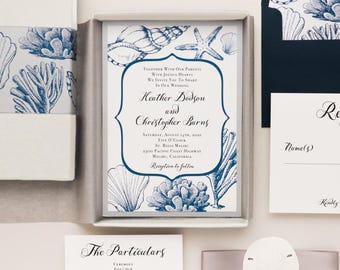 May include: A wedding invitation set featuring a white card with blue ink illustrations of seashells, starfish, and coral. The text reads: Together with our parents with joyous hearts we invite you to share in our wedding Heather Dodson and Christopher Barns.