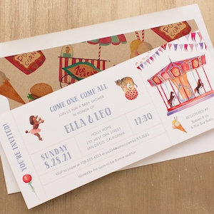 May include: Baby shower invitation with a carnival theme. The invitation features illustrations of a carousel, a tiger on a ball, and a dachshund in a tutu. The text reads "Come One, Come All" and includes the names Ella & Leo, date, time, and RSVP information.