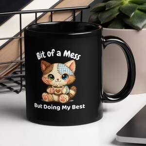 May include: A set of three ceramic mugs with a speckled, matte finish in cream, light grey, and dark grey. Each mug has a simple, minimalist design and a rounded handle.