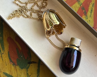 Charming vintage Avon eggplant pendant perfume bottle necklace - new in original box