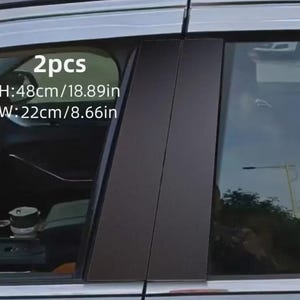 May include: Two black car pillar trims. The height is 18.89 inches (48cm), and the width is 8.66 inches (22cm). The image shows the trims installed on a car door, with the car's interior visible through the window.